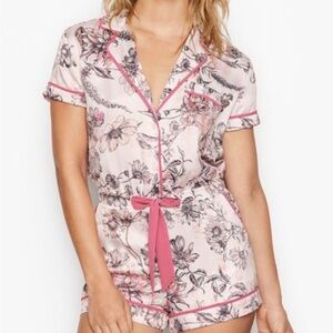 Victoria’s Secret satin floral romper with drawstring waist. Large